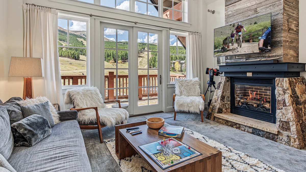Great Room in Summer, Main Level - Fireplace with TV and seating area
