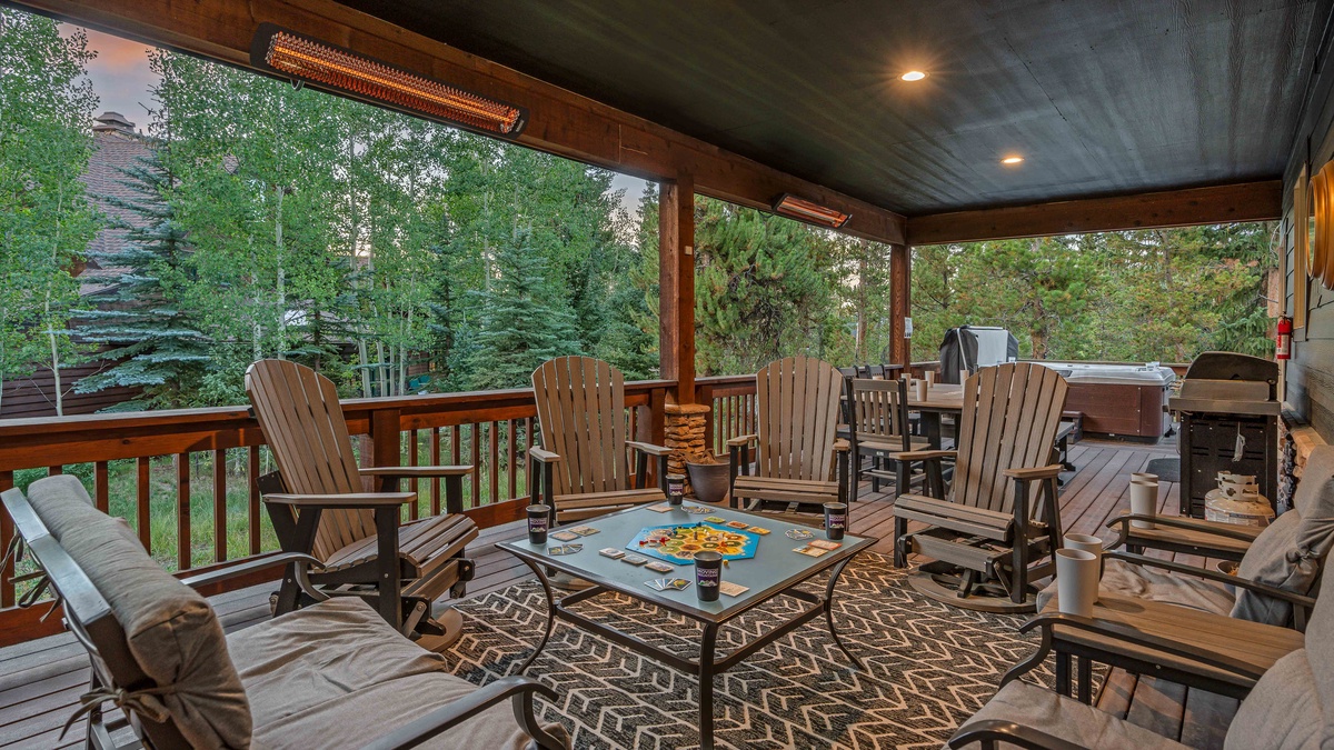 Covered back patio area with grill and seating