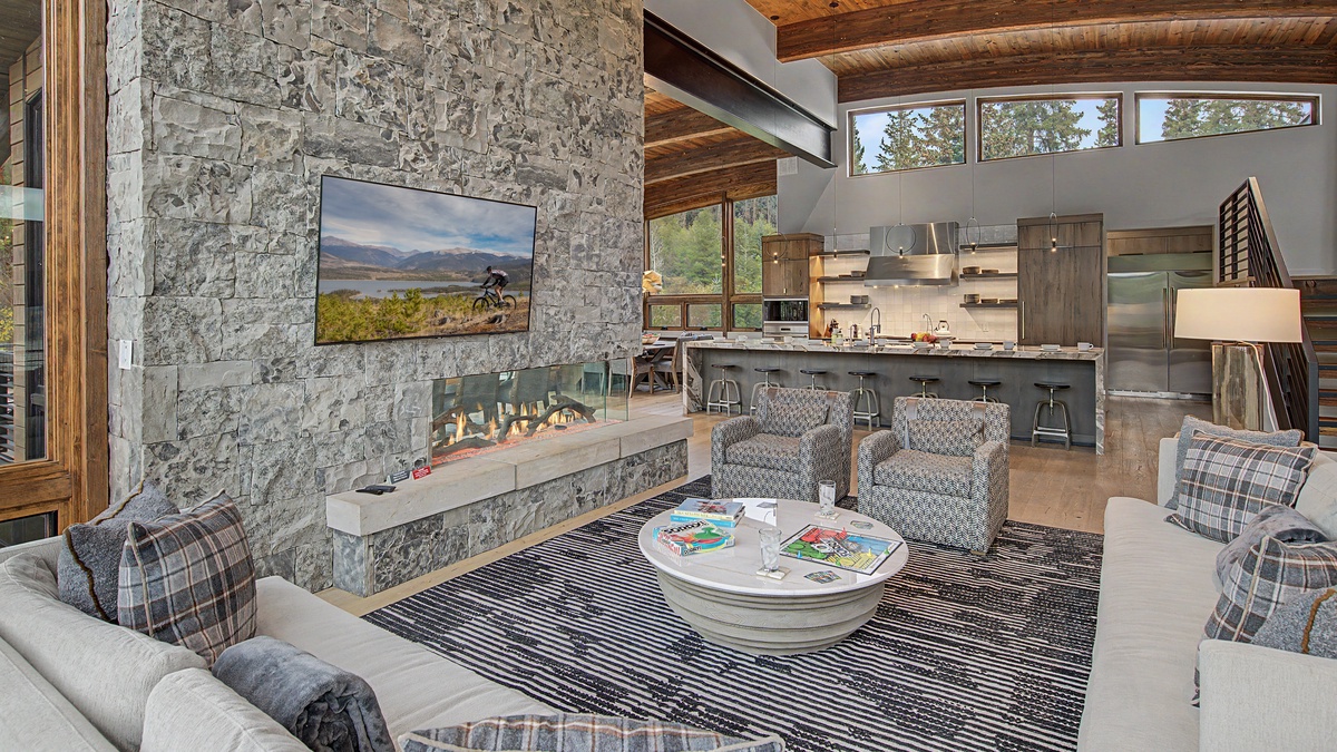 Great Room, Uppermost Level - Fireplace with seating area beside kitchen