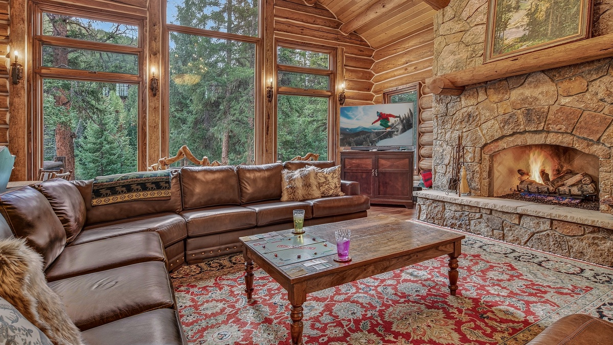 Great Room, Main Level - Seating area with large windows and fireplace