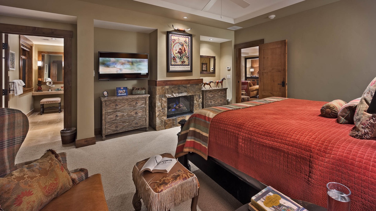 Bedroom 1, Main Level - Primary king suite with fireplace and TV
