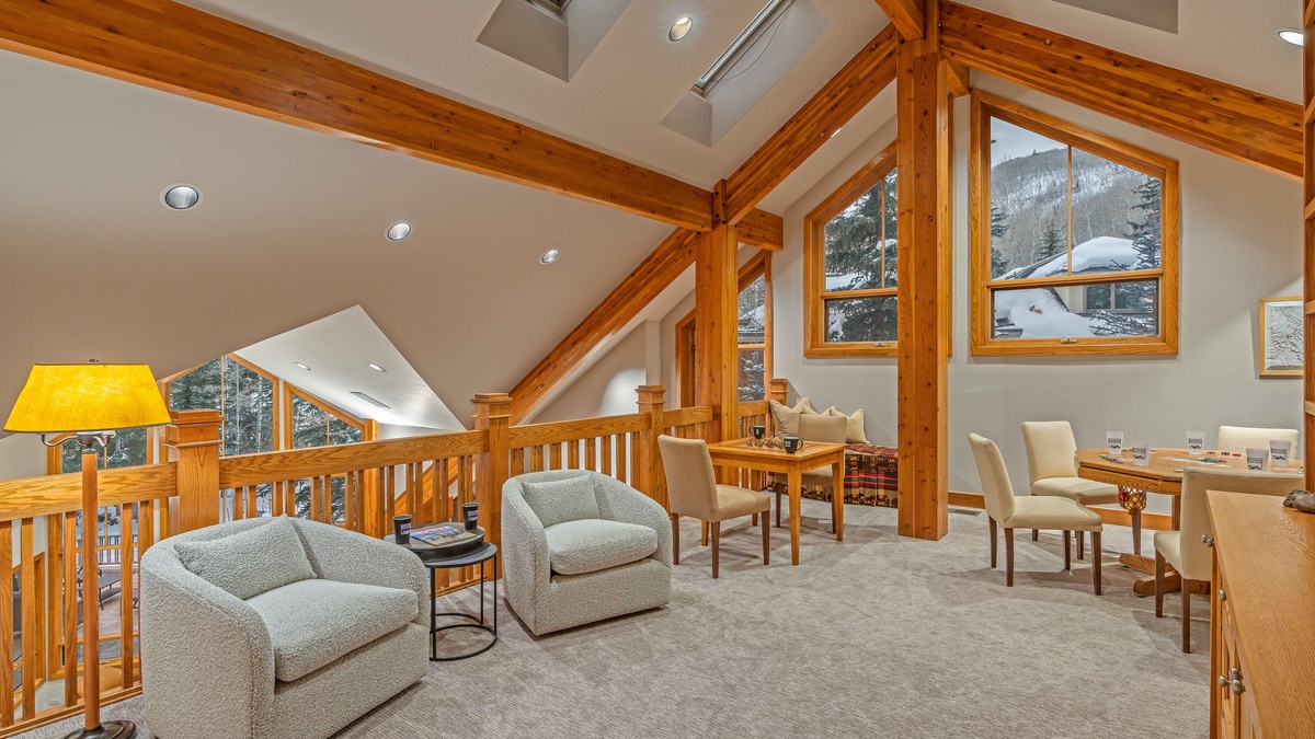 Overlooking the great room is the loft level, with poker/bumper pool table and infinity spa access