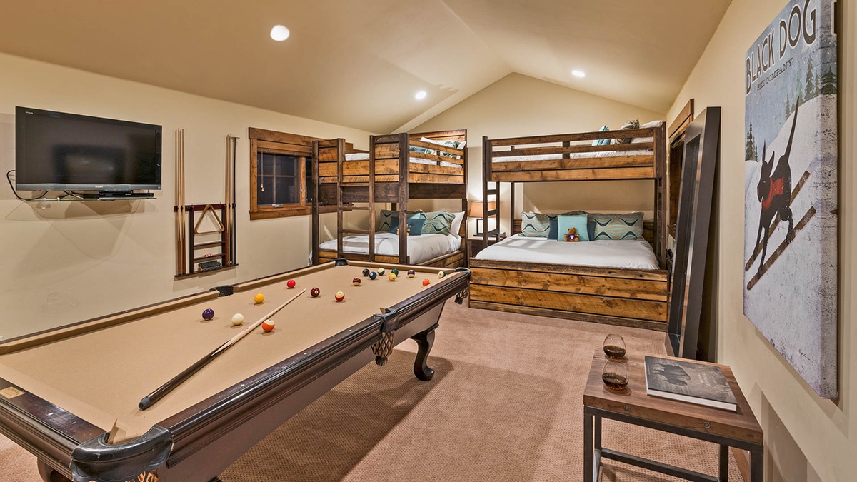 Upper level bunk bedroom with billiards