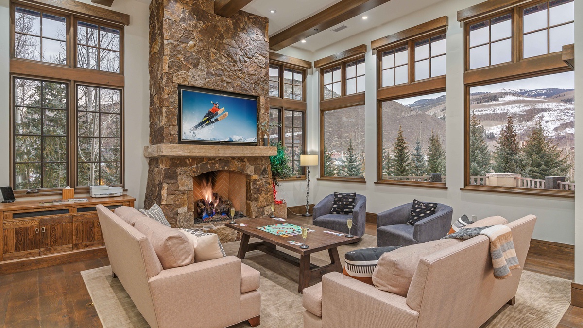 Main level great room with TV and fireplace