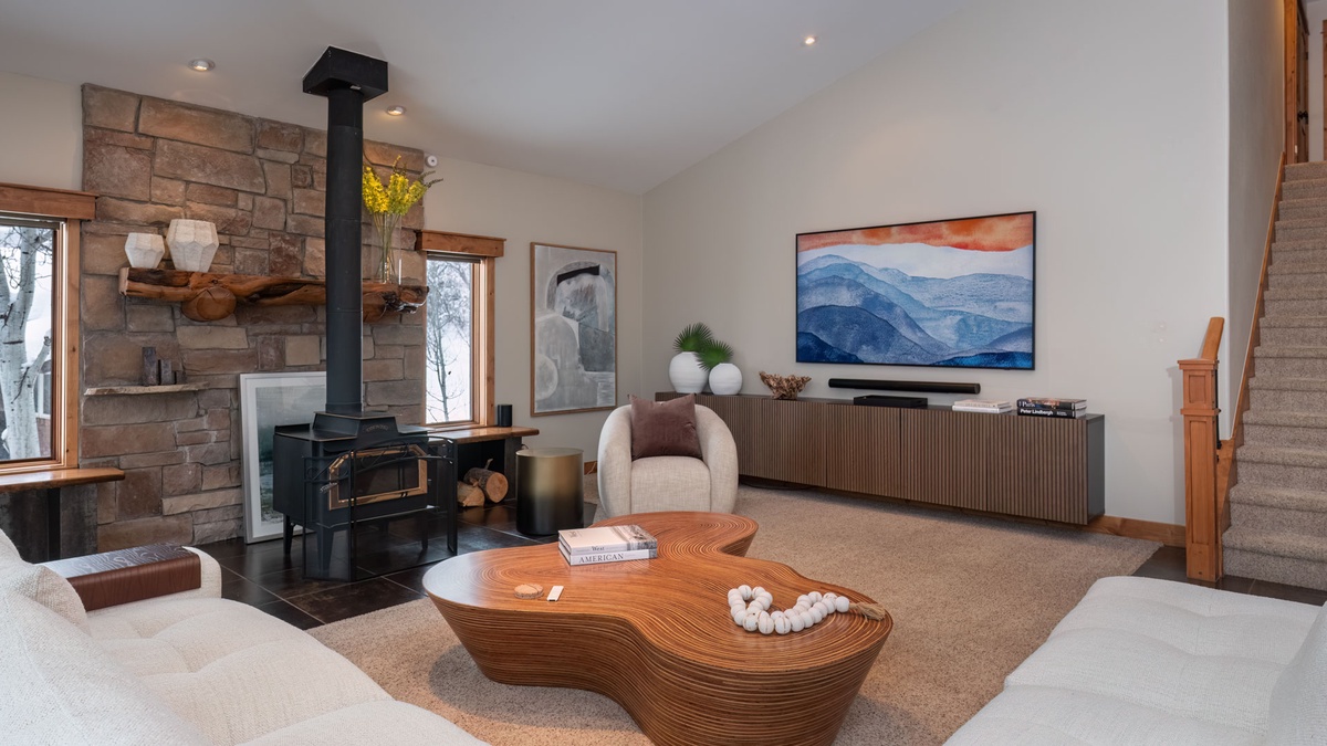 Great Room, Main Level - With wood fireplace and large television