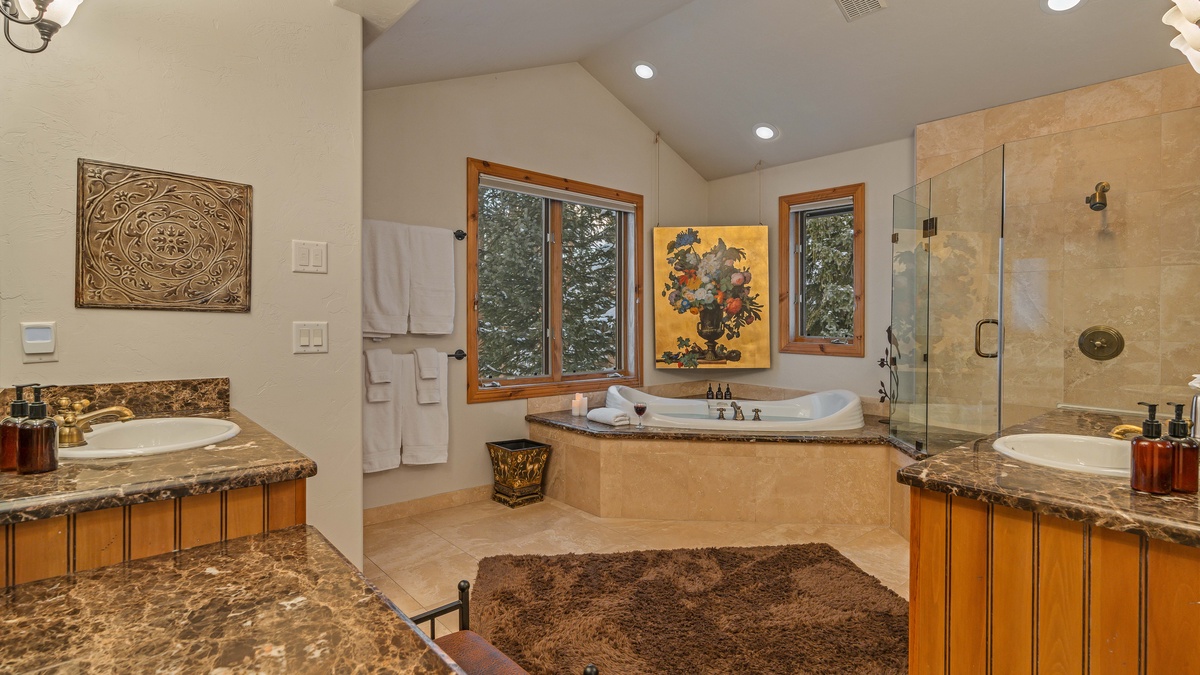 Bedroom 1, Main Level - Primary king ensuite with tub, shower and his/her sinks