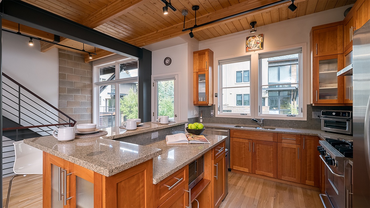 Kitchen, Main Level - Sink with surrounding countertops and large windows