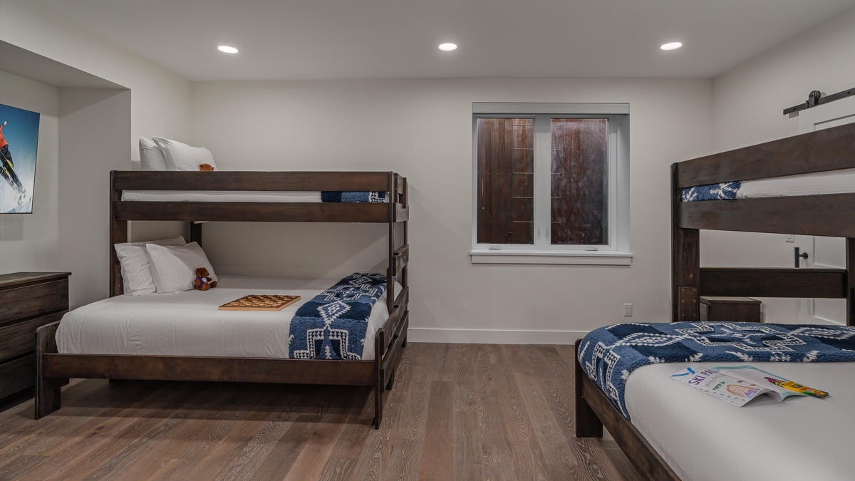 Bunkroom on lower level with two twin-over-queen bunks