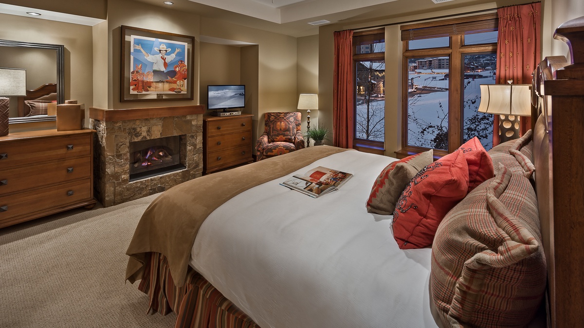 Bedroom 1, Main Level - Primary king suite with fireplace and TV