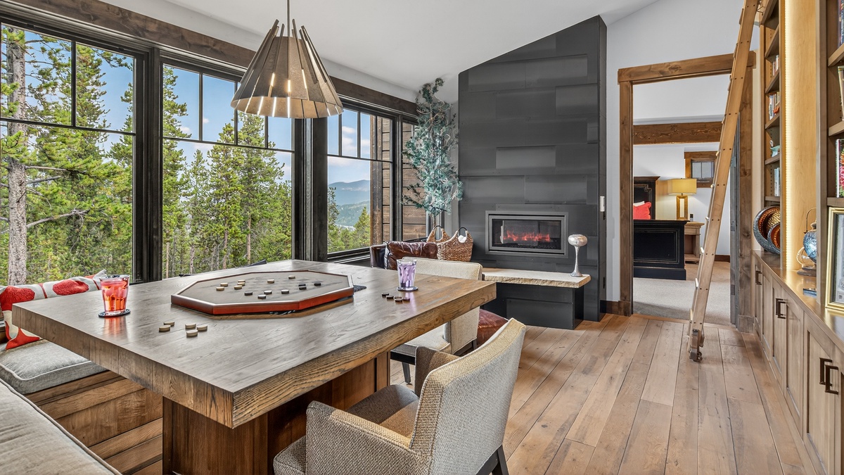 Bedroom 1 and Bedroom 2, Upper Level - Sitting room with library and fireplace between the two bedrooms