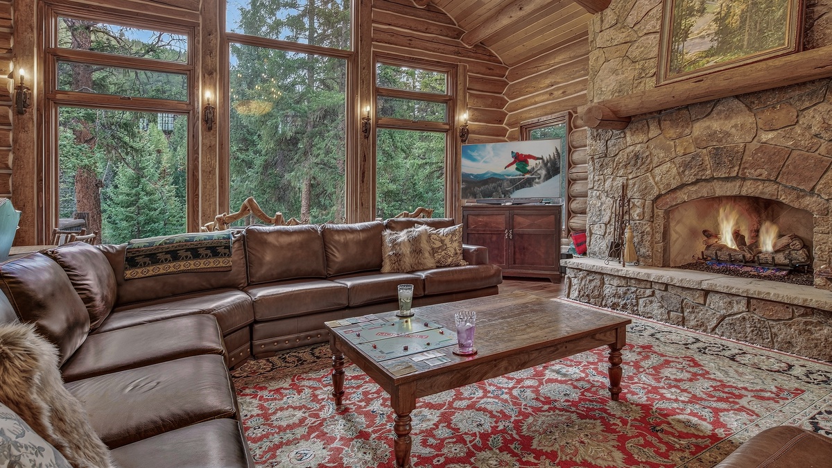 Great Room, Main Level - Seating area with large windows and fireplace