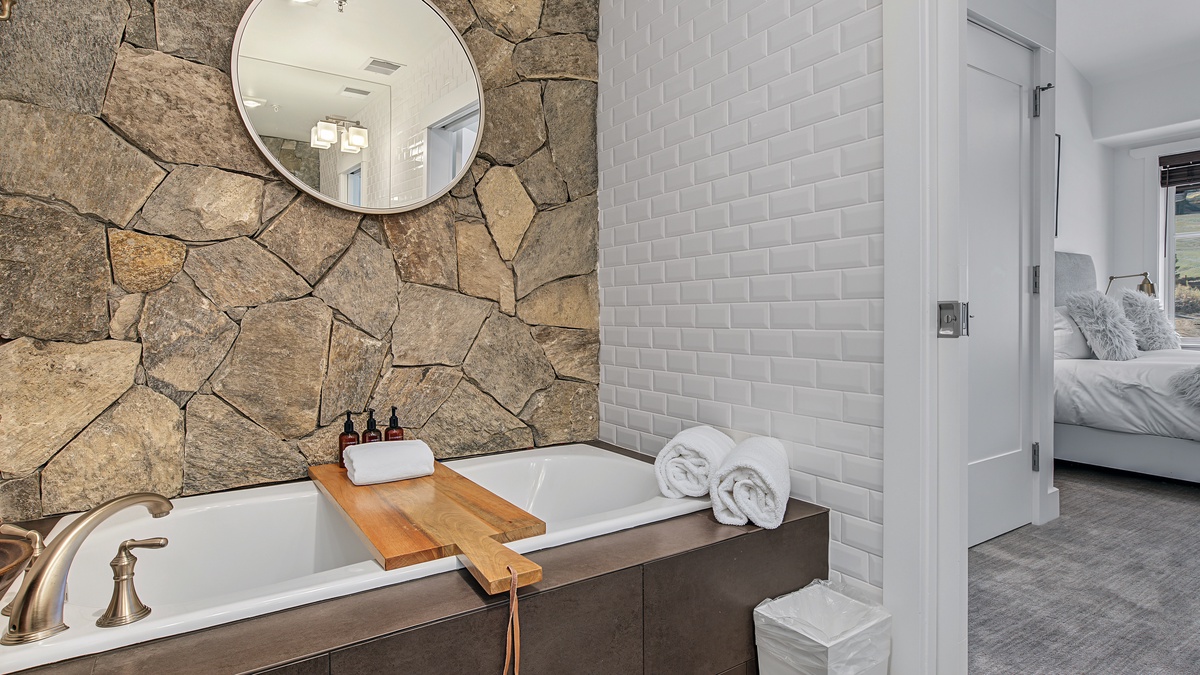 Bedroom 1, Main Level - Primary ensuite with soaking tub