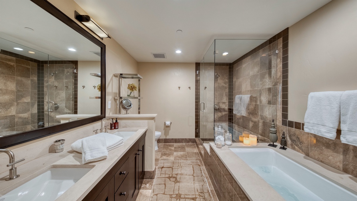 Bedroom 1, Main Level - Primary bedroom ensuite spa-style tub and walk-in shower