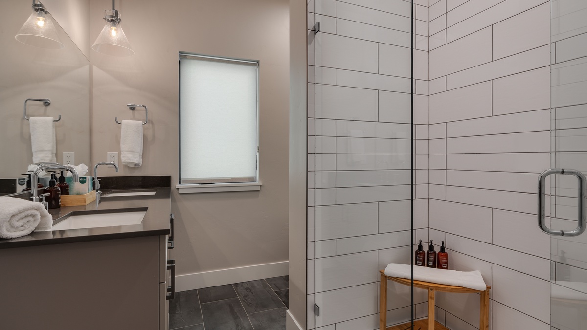 Bedroom 1, Upper Level, Borough House - Sleek bathroom with walk-in glass shower and modern vanity