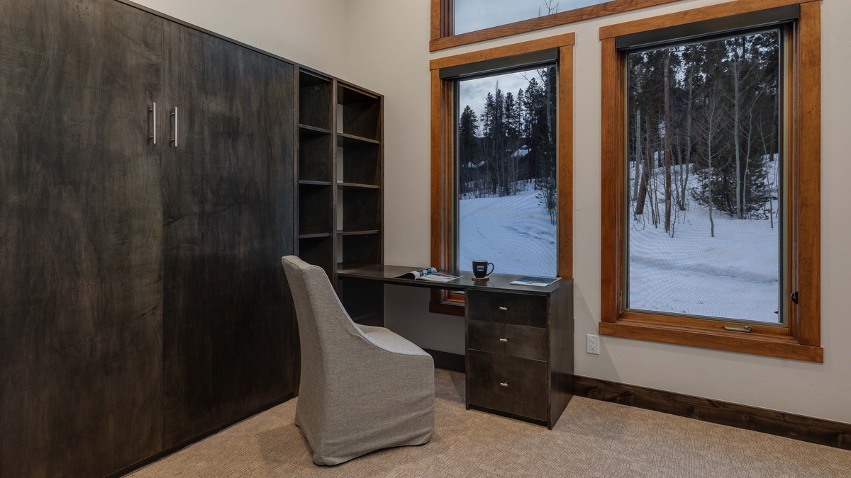Private office space with a murphy bed on main level
