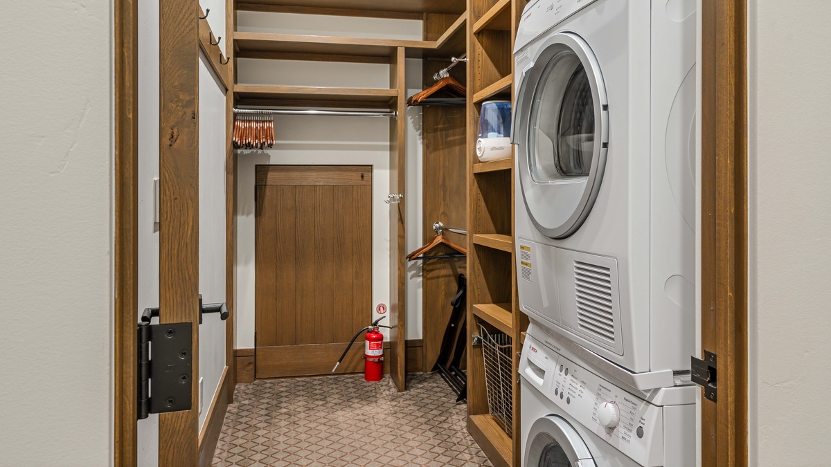 Primary king suite closet with washer and dryer