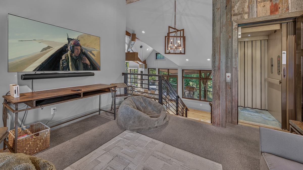 Living Room, Uppermost Level - Seating area with TV
