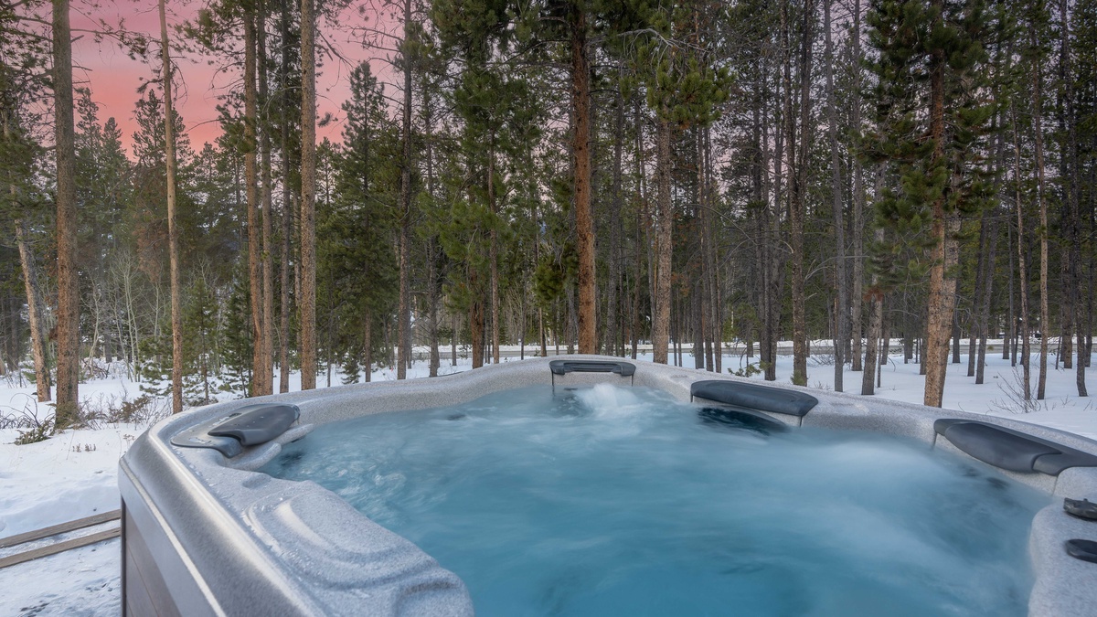 Hot tub tucked away in the pines