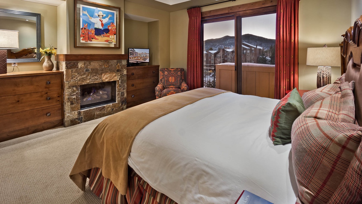 Bedroom 1, Main Level - Primary king suite with fireplace and TV