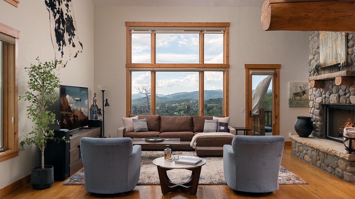 Great Room, Main Level - Seating area with stone fireplace and mountain views