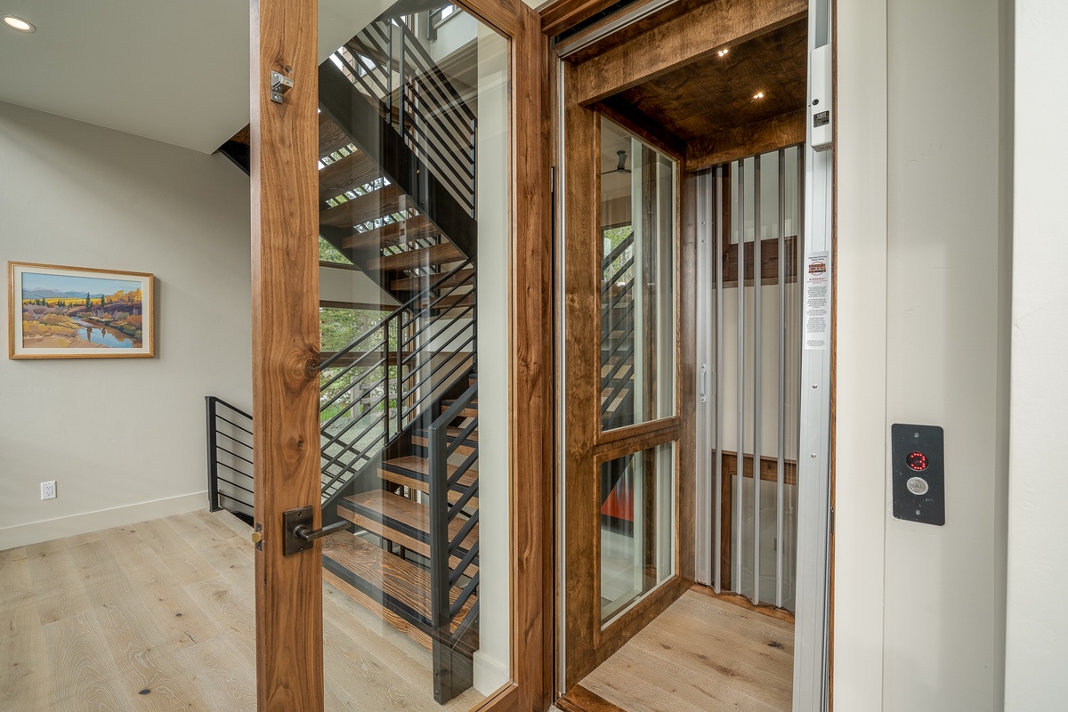 Glass-enclosed elevator to access all levels