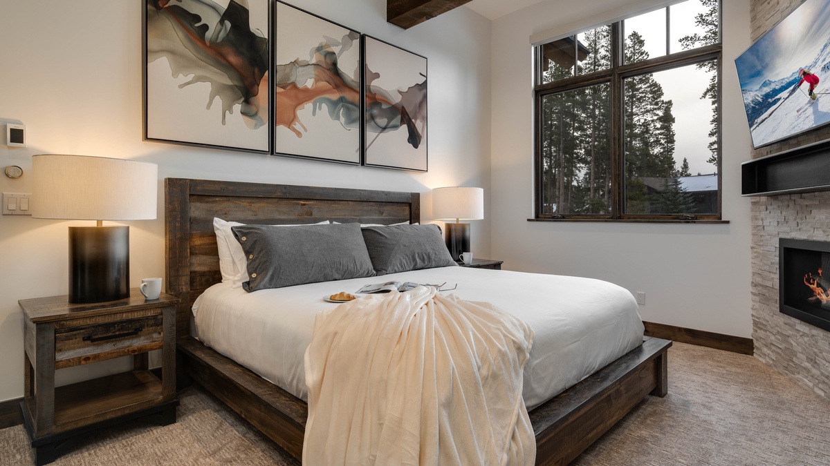 Bedroom 1, Main Level - Primary bedroom with fireplace