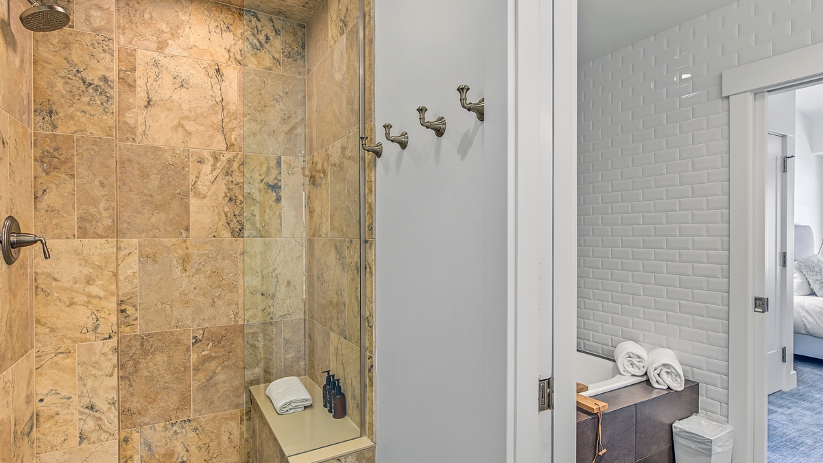 Bedroom 1, Main Level - Primary ensuite with soaking tub, walk-in shower