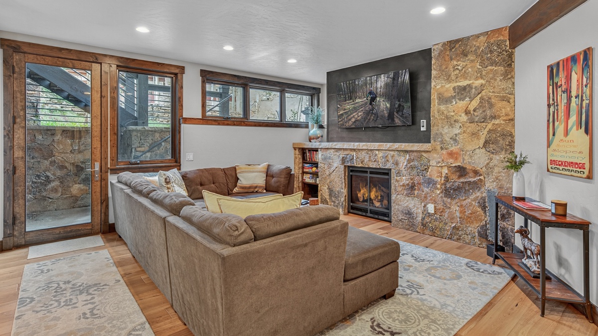 Family Room, Lower Level - Sectional seating with fireplace and television