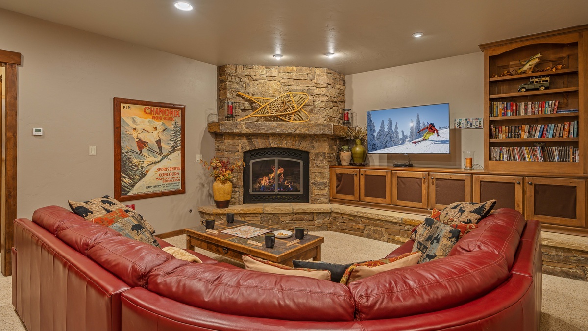 Lower level family room with gas fireplace and TV