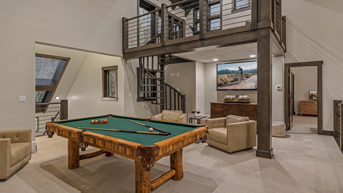 Family room on upper (6th) level with billiards, TV, and loft access