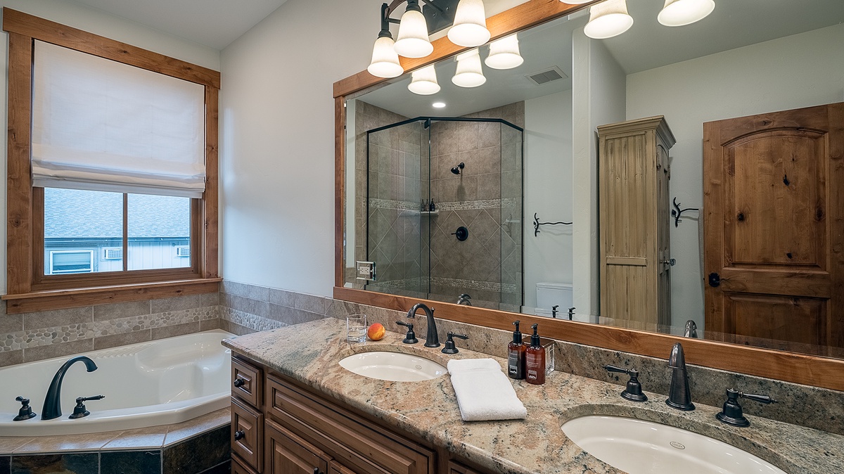 Bedroom 1, Main Level - Primary ensuite with double vanity and walk-in shower