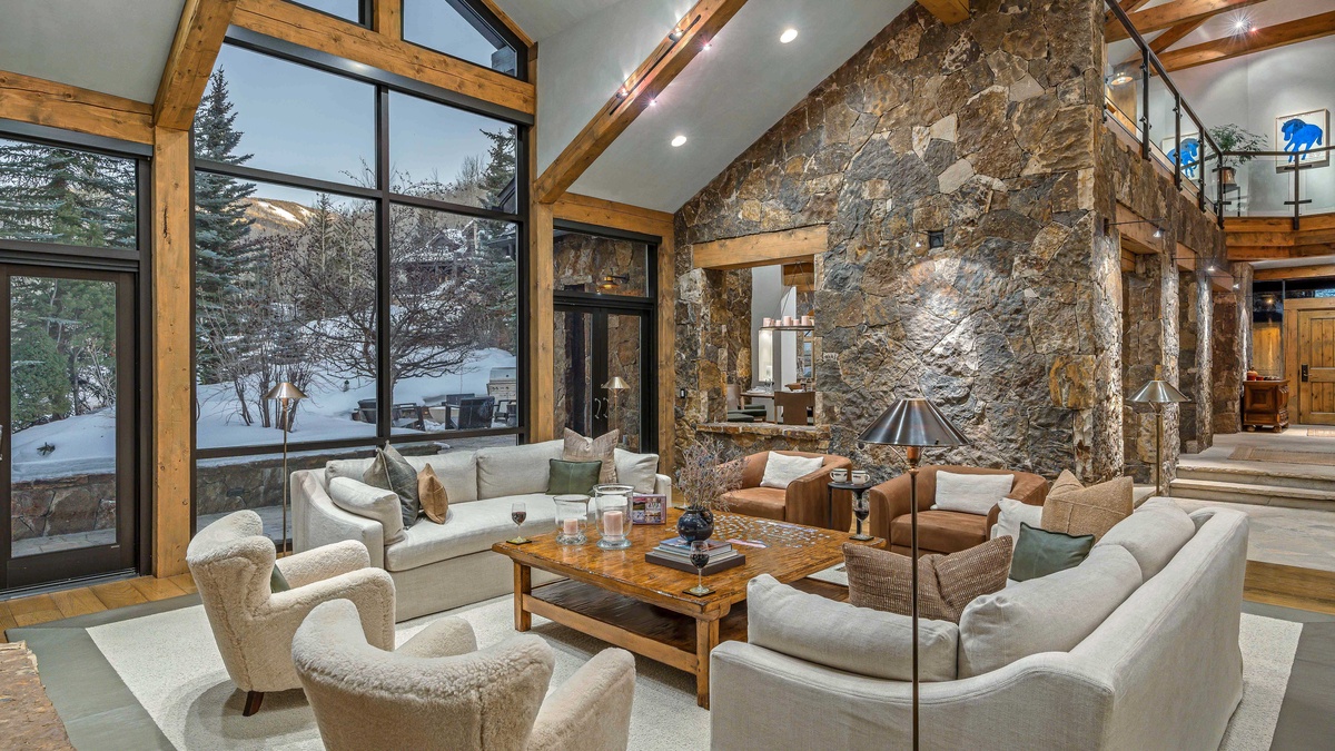 Spacious great room with main patio access, looking toward dining and kitchen area