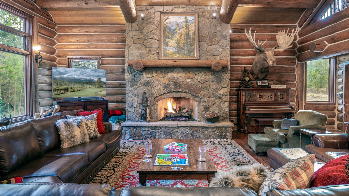 Great Room, Main Level - Stone fireplace with TV and seating area