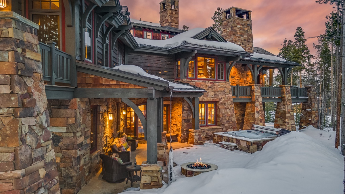 Aerial of back patio with hot tub and firepit
