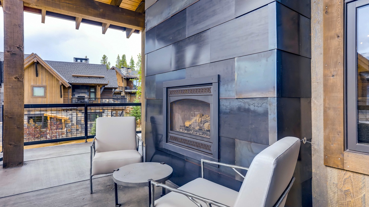 Primary suite outdoor seating and fireplace