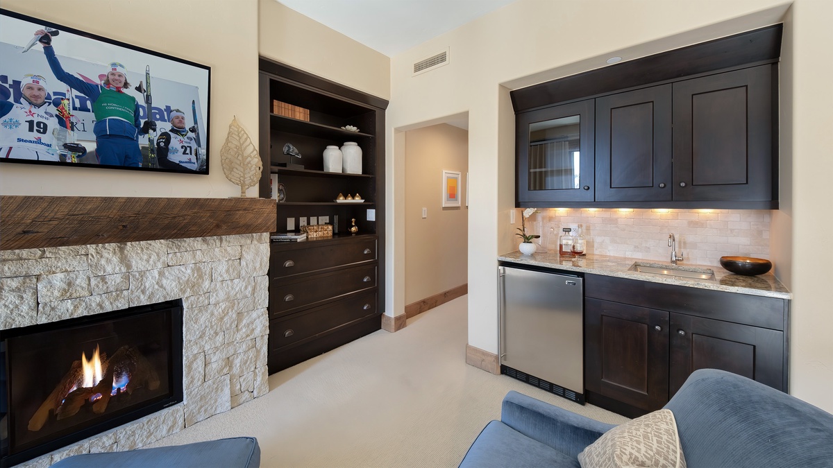 Bedroom 1, Main Level - Primary suite with fireplace and mini bar