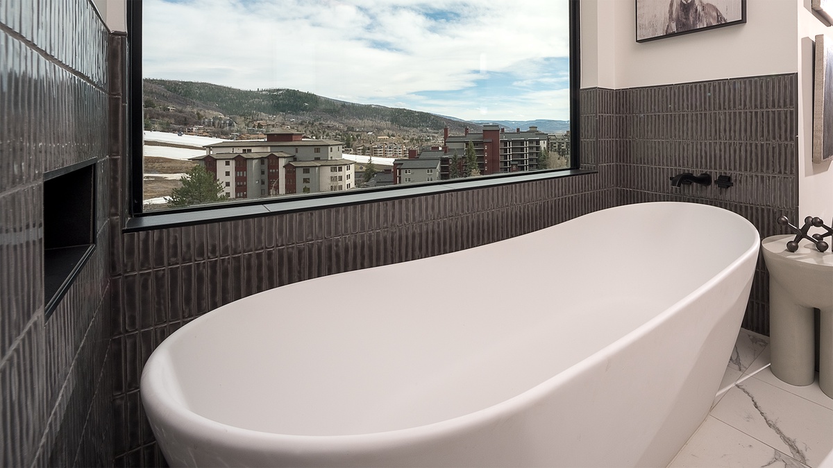 Bedroom 1, Main Level - Ensuite bathroom with freestanding tub and mountain views