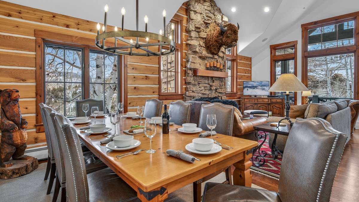 Gather around this warm dining space where rustic stone meets modern comfort for memorable meals together.
