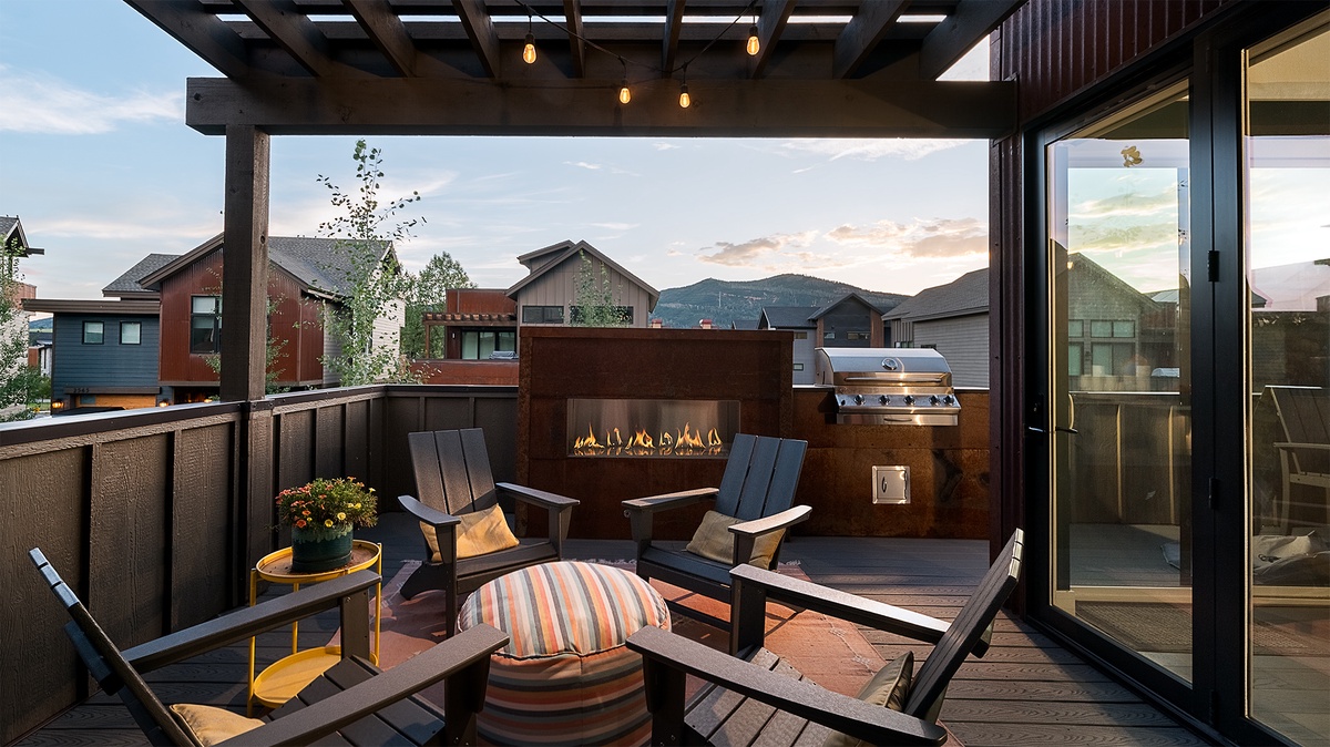 Deck, Upper Level - Outdoor fireplace with seating area