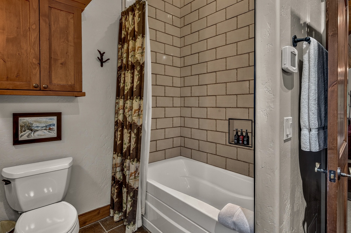 Bedroom 1, Upper Level - Primary ensuite with shower/tub combo