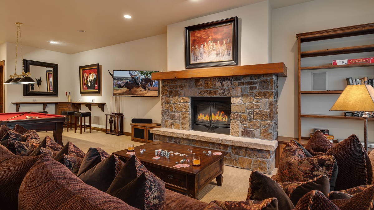 Family Room, Lower Level - Cozy lounge area with stone fireplace