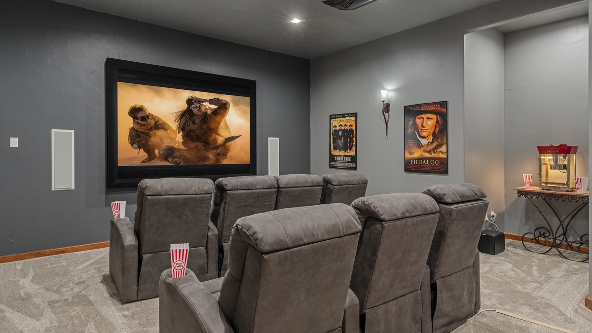 Grab some popcorn and watch a movie in the theater room!