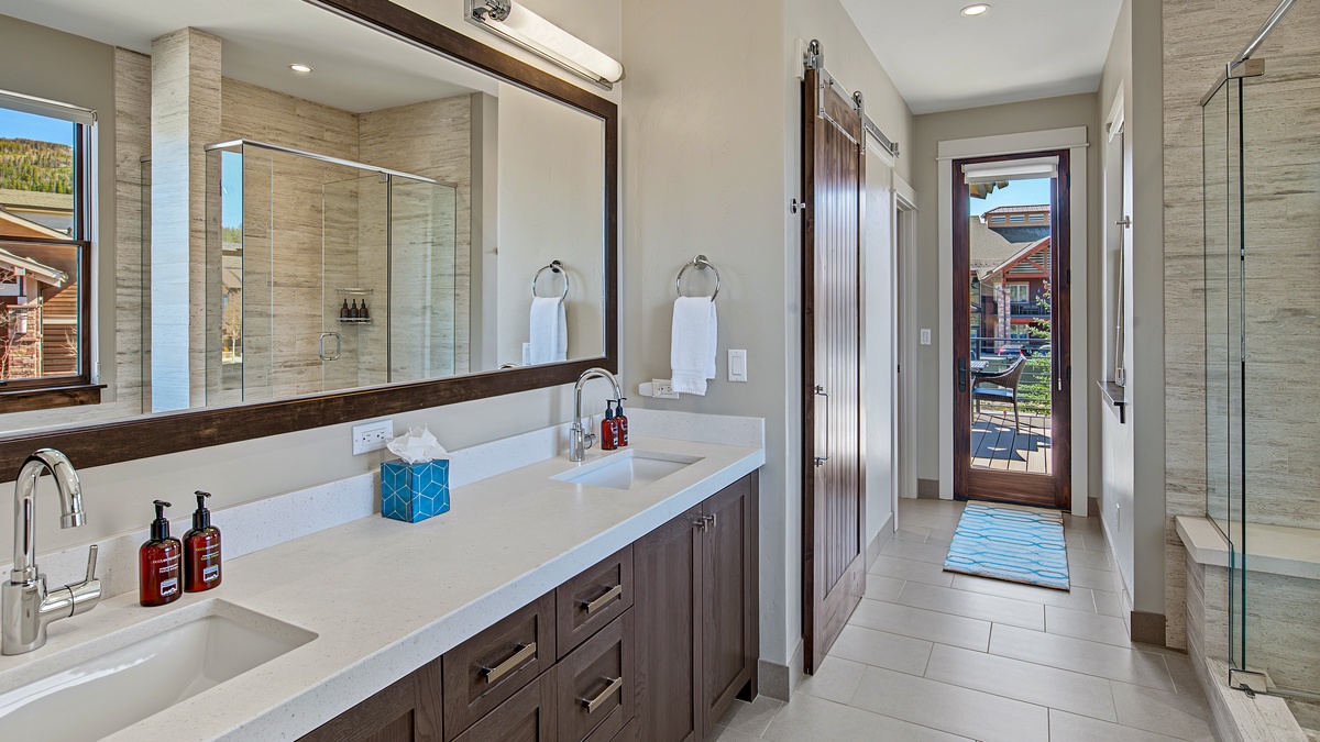 Bedroom 1, Main Level - Primary ensuite with double vanity and walk-in shower