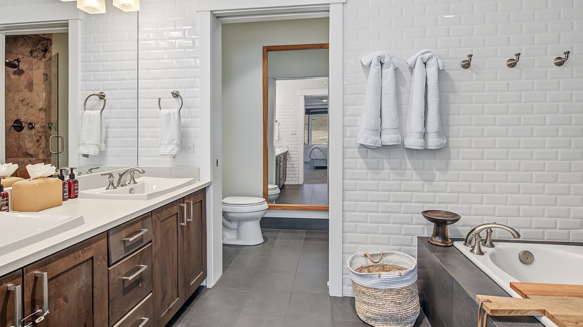 Bedroom 1, Main Level - Primary ensuite with soaking tub, walk-in shower, and double vanity