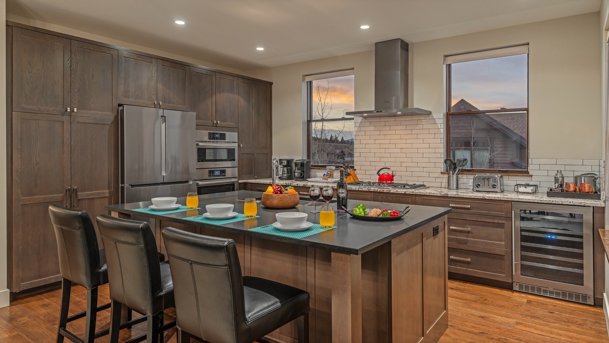 Gourmet kitchen with breakfast bar seating and modern appliances