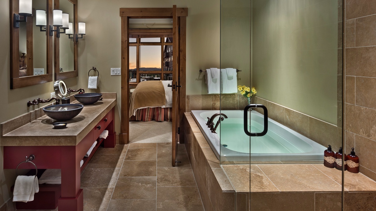 Bedroom 1, Main Level - Primary ensuite with soaking tub and walk-in shower