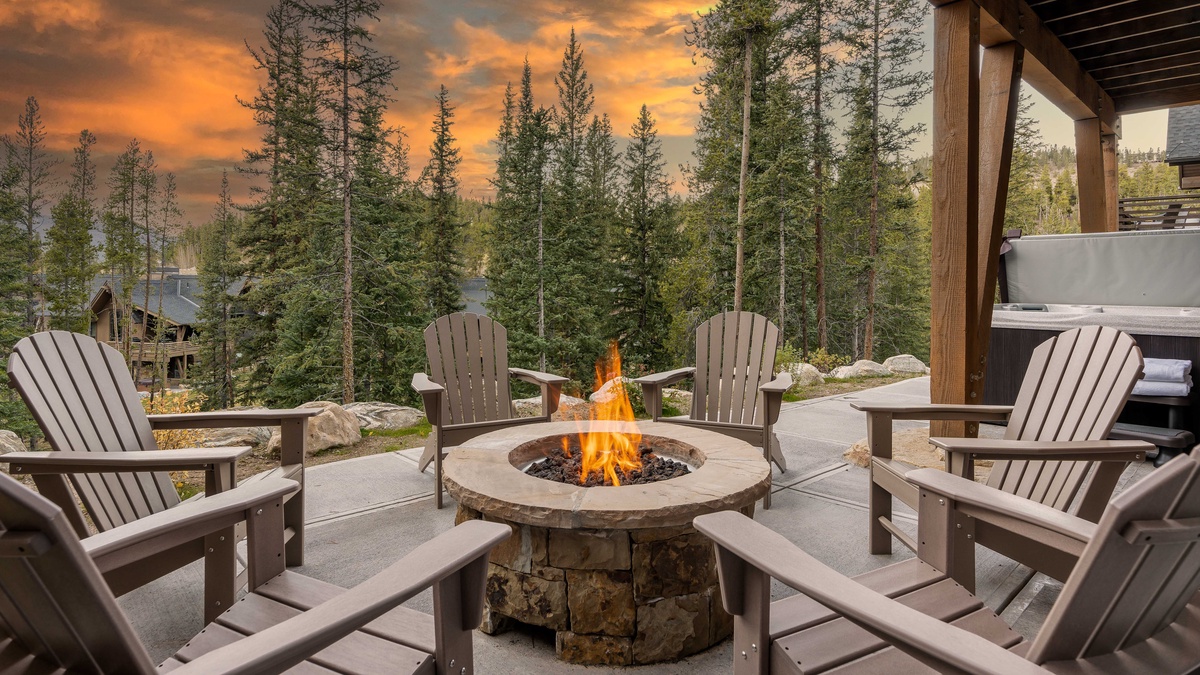 Enjoy cozy sunsets by the fire on the lower patio