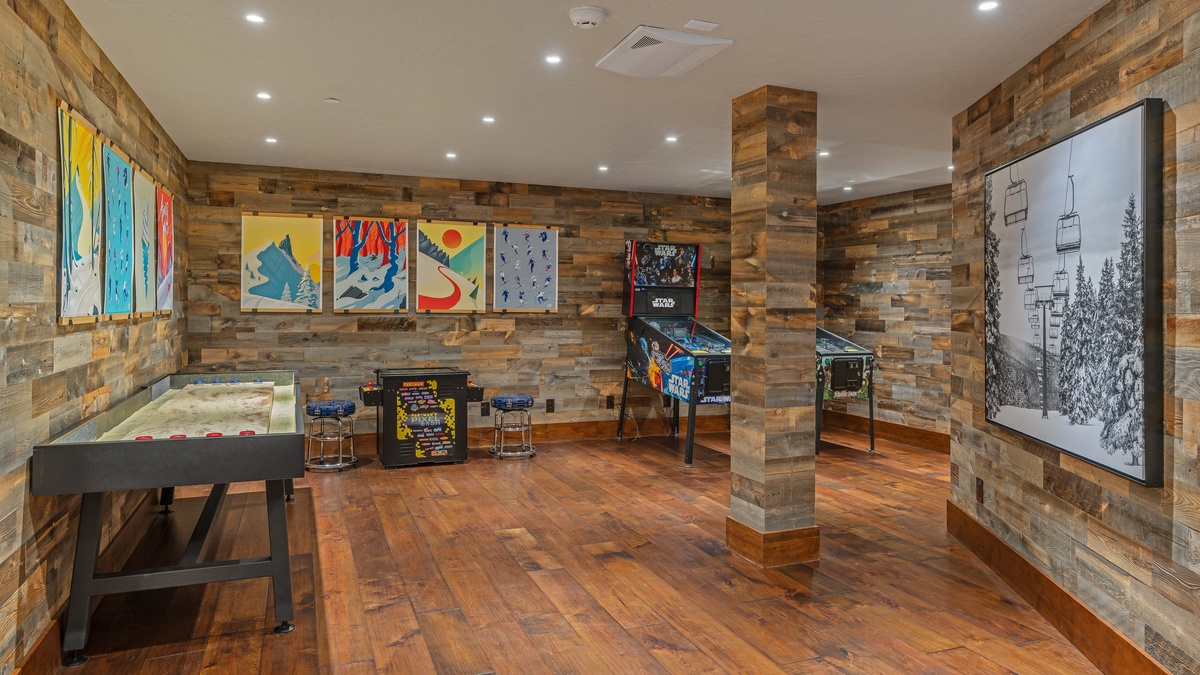 Lower level game room with shuffleboard, PacMan, and pinball