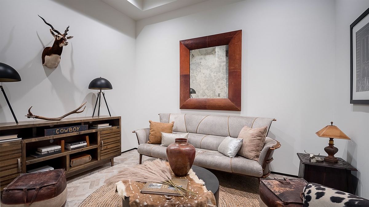 Family Room, Main Level - Seating area with sofa, accent chairs, and wood framed artwork, located off of entry area