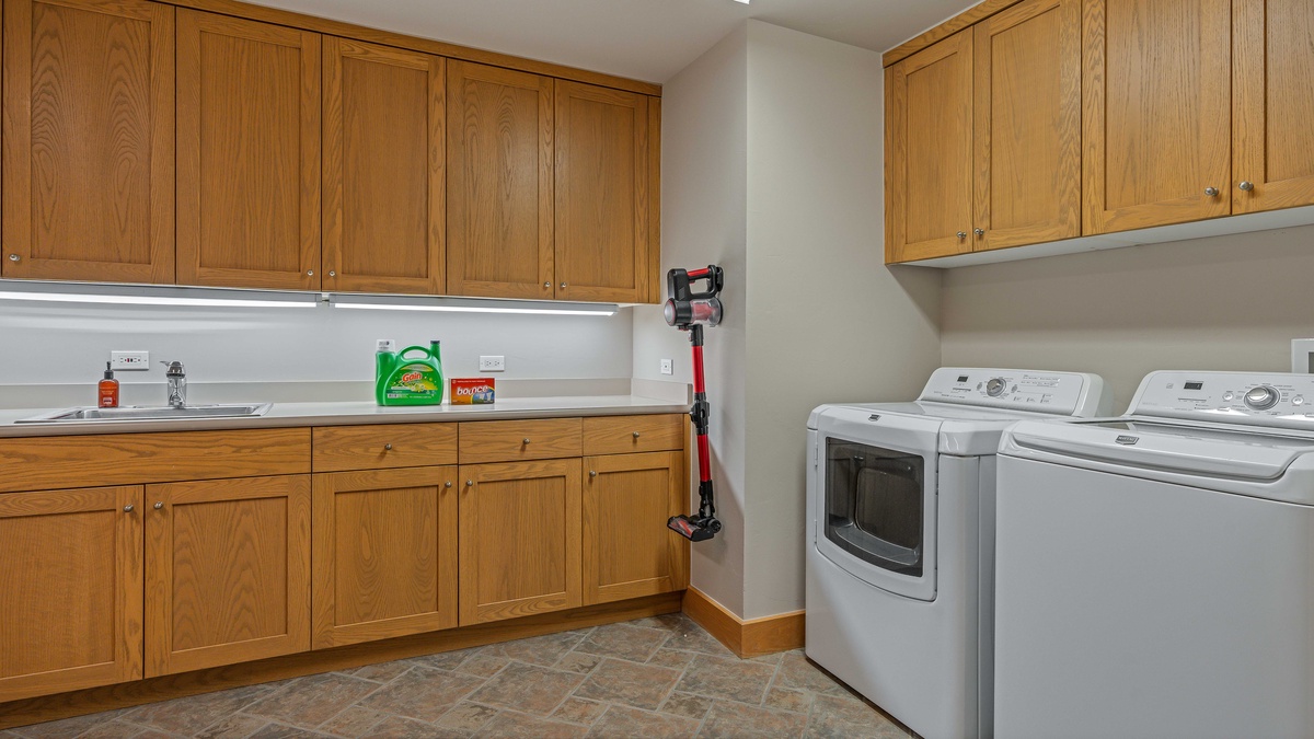 Laundry room on lower level with dual washer and dryer